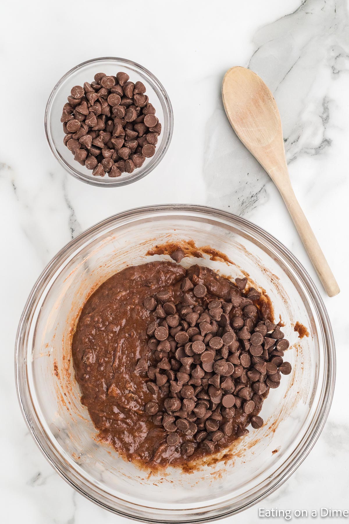 Mixing the chocolate chips into the brownie batter