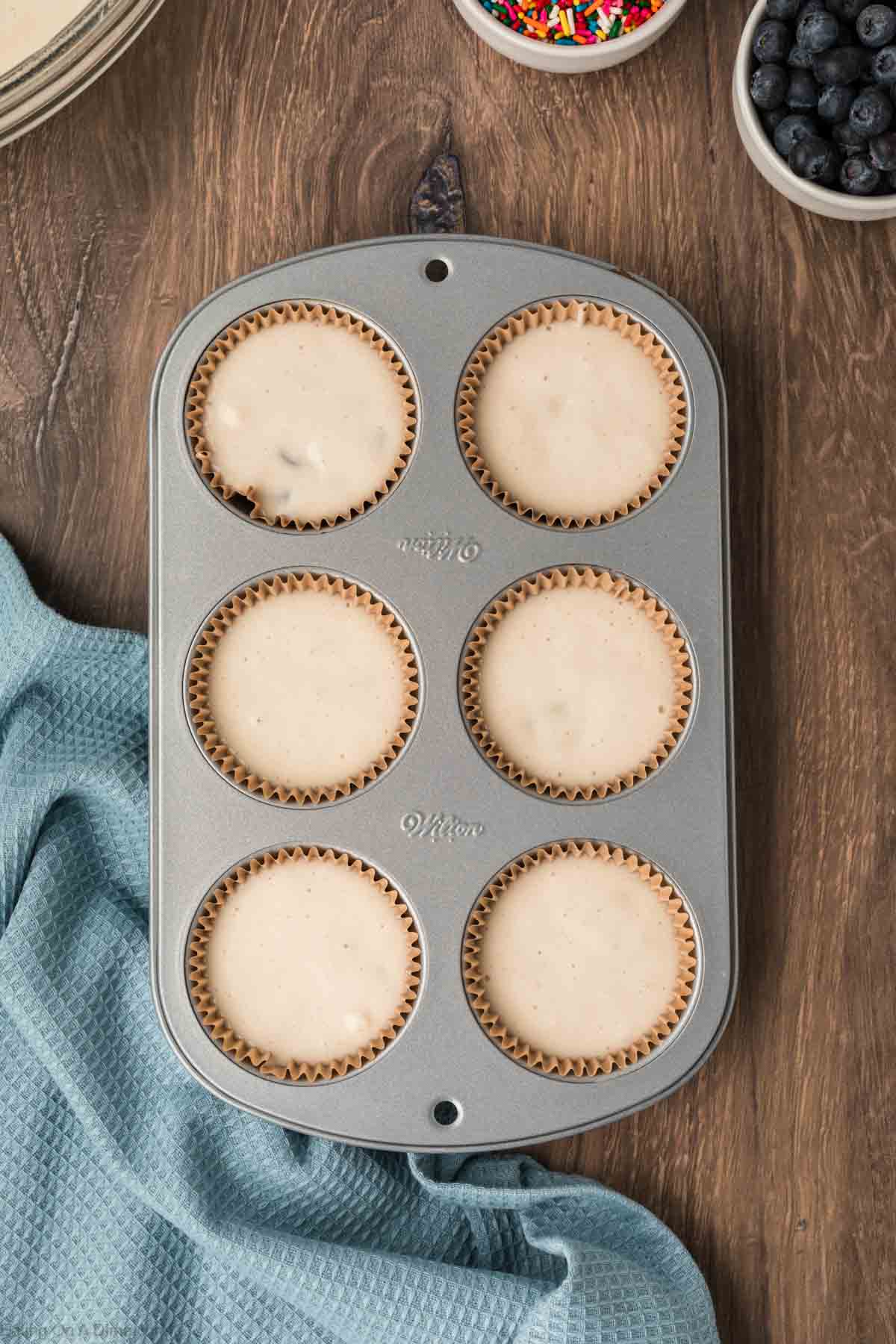 Pouring the pancake batter in the muffin tin