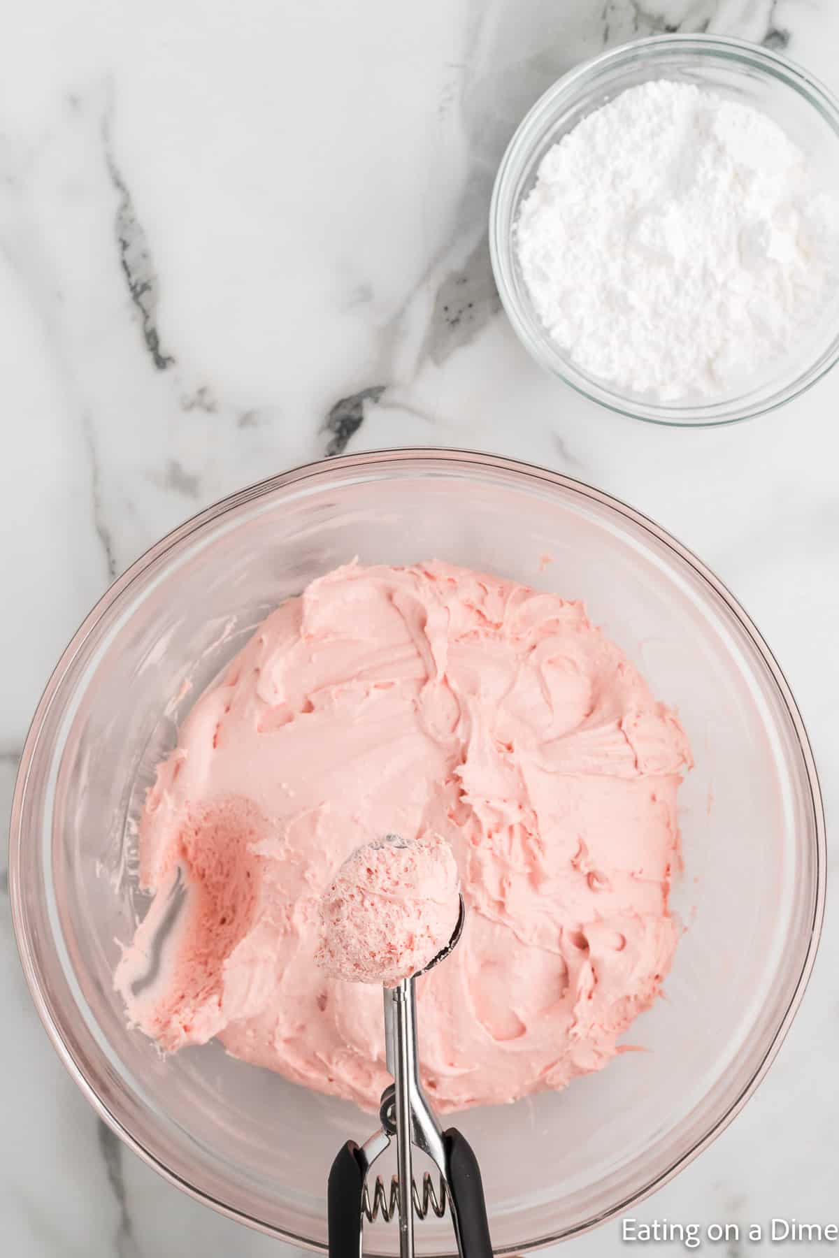 Scooping the dough with a cookie scoop