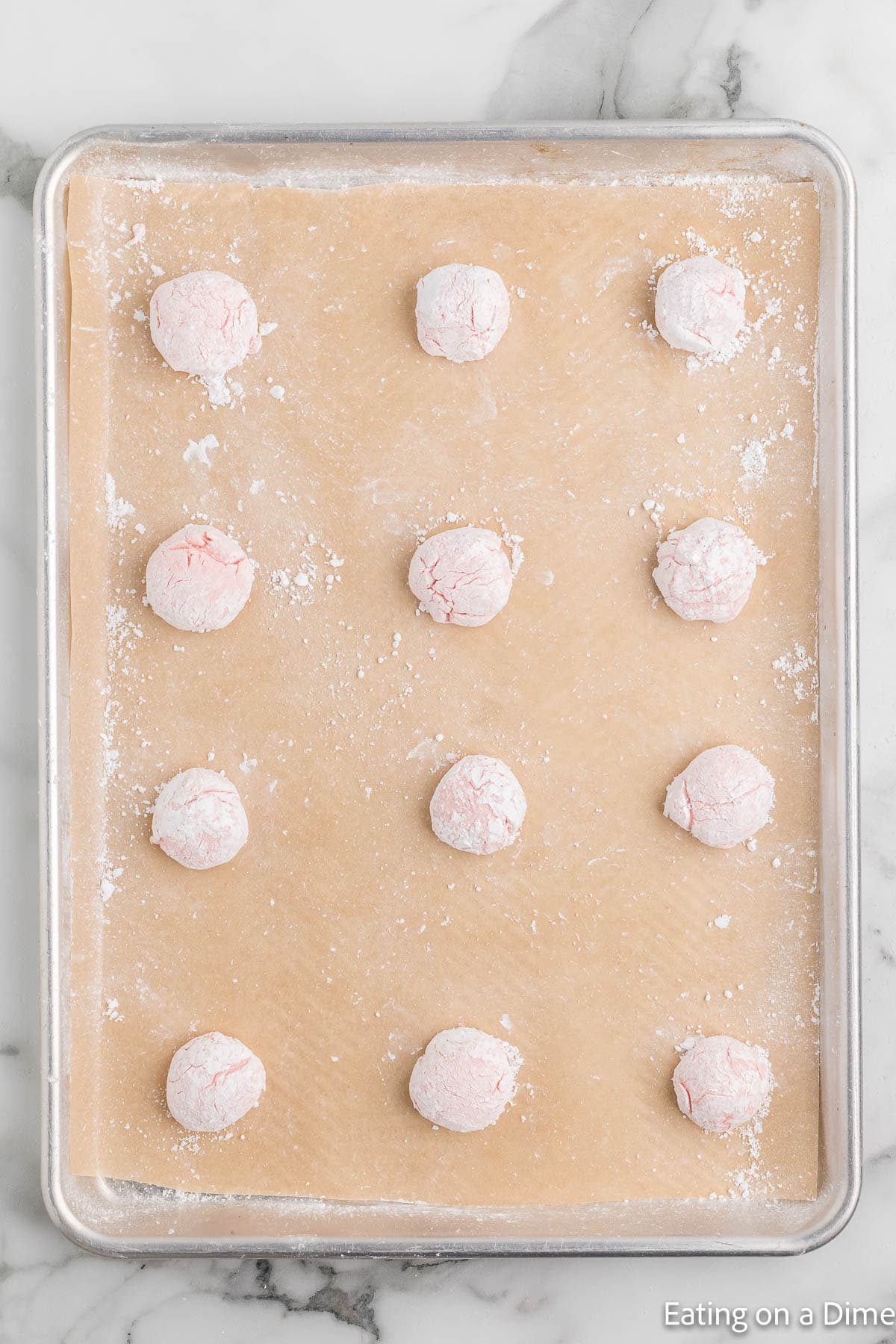 Placing dough balls on a baking sheet