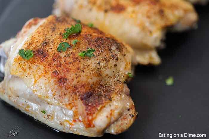 Oven baked chicken thighs recipe is so delicious and easy to make in just 30 minutes. The outside is crispy while the inside is juicy and flavorful.  Learn how long to cook the best oven baked bone in skin on chicken. Healthy recipes are flavorful with paprika and other seasonings in this simple bone in recipe. Make perfect chicken in oven. #eatingonadime #bakedchickenthighs #RecipesOven #CrispyOven #RecipesOvenBoneIn #BoneInSimple #easyoven #boneincrispy