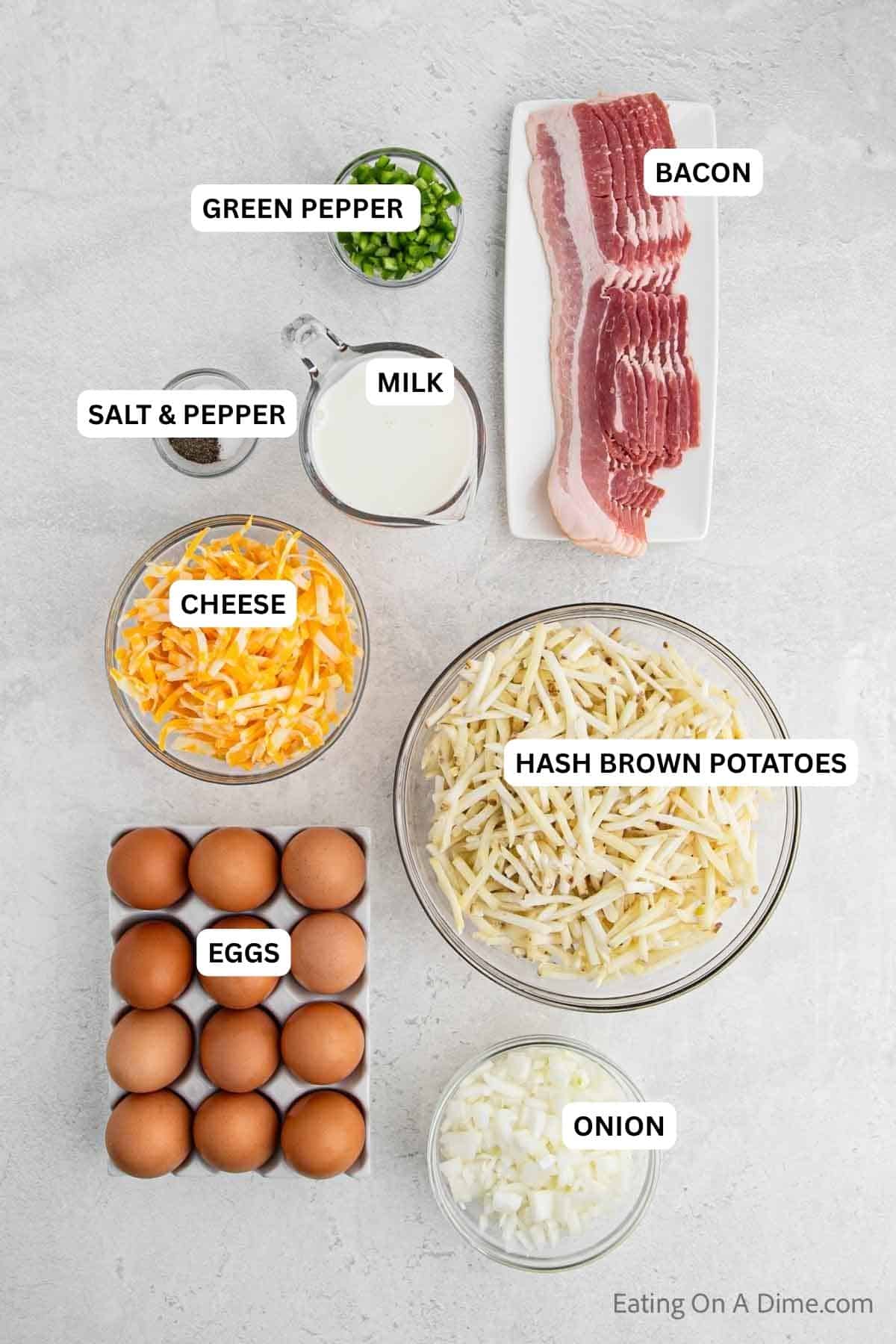 Ingredients for recipe: onion, egg, hash brown potatoes, cheese, bacon, milk, salt, pepper and green pepper.