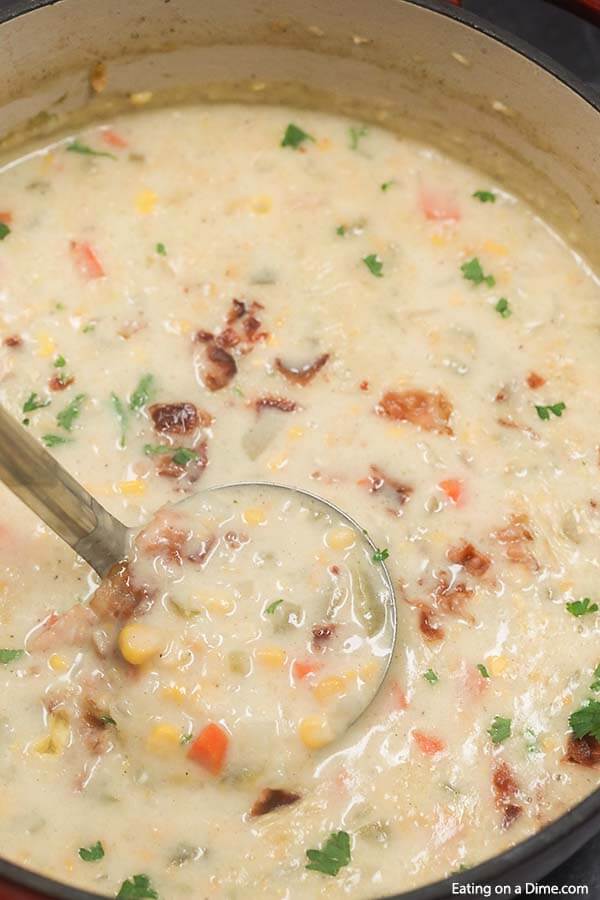Corn chowder recipe is easy to make with creamed corn, potatoes and delicious seasonings. You can make this cream soup on the stove top in 30 minutes. Learn how to make this simple and healthy potato and corn soup. Top with bacon and cheddar! #eatingonadime #cornchowderrecipe #easyfast #soupeasy #baconpotato #cheesy #vegetarian 