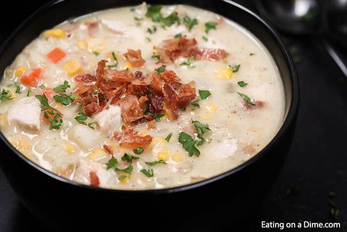 Enjoy delicious Crock pot chicken corn chowder recipe with hardly any work. Come home to the best comfort food when you make chicken corn chowder! This healthy slow cooker recipe is easy, cheesy and the best soup. Learn how to make homemade Crock pot chicken corn chowder that is so creamy. #eatingonadime #chickenandcornchowder #souprecipes #soupcrockpot #CrockPotEasy #Crockpotslowcooker #souphealthy #crockpot #chickenandcornchowdercrockpot