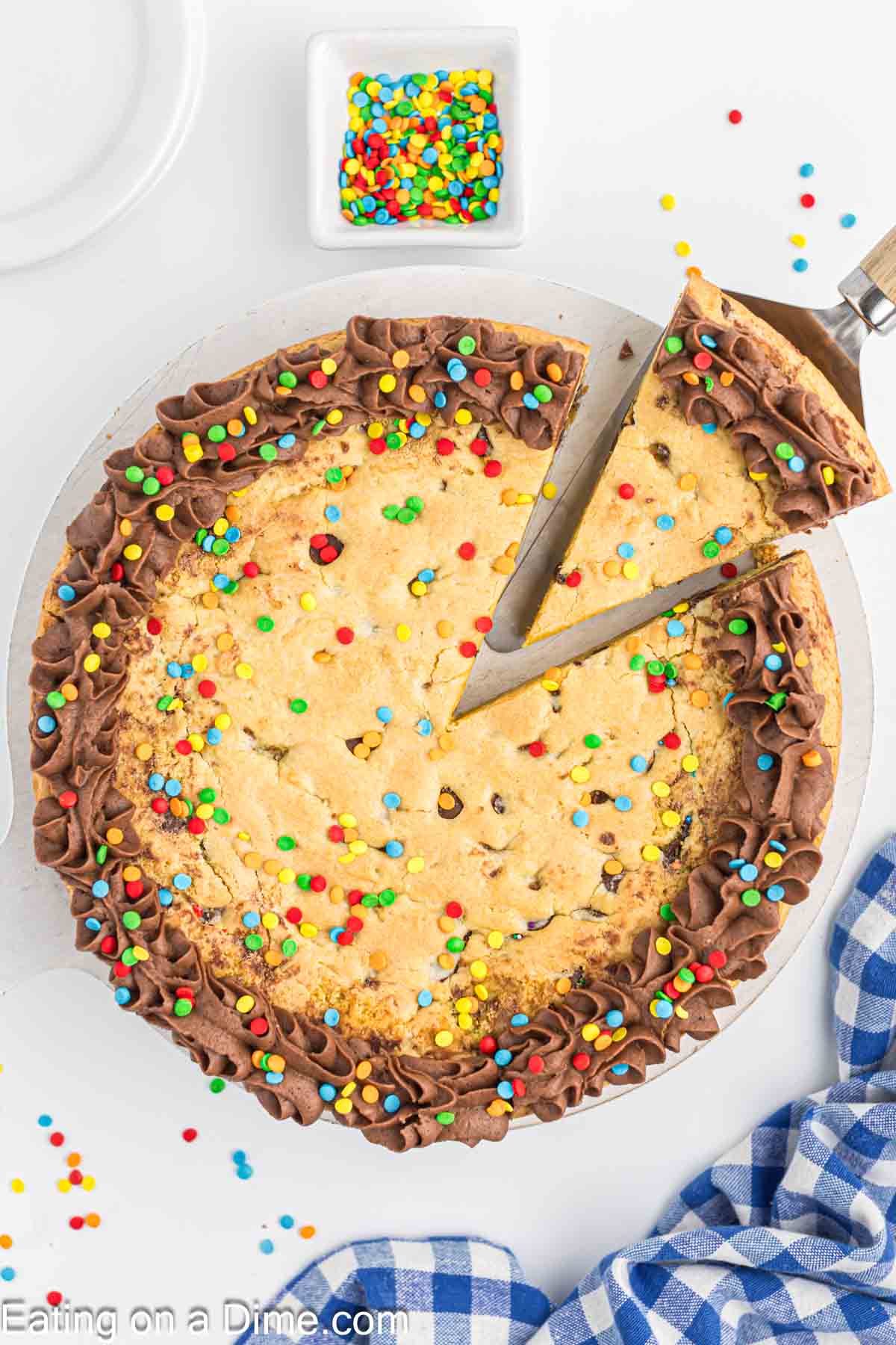 Cake Mix cookie cake topped with chocolate frosting and sprinkles