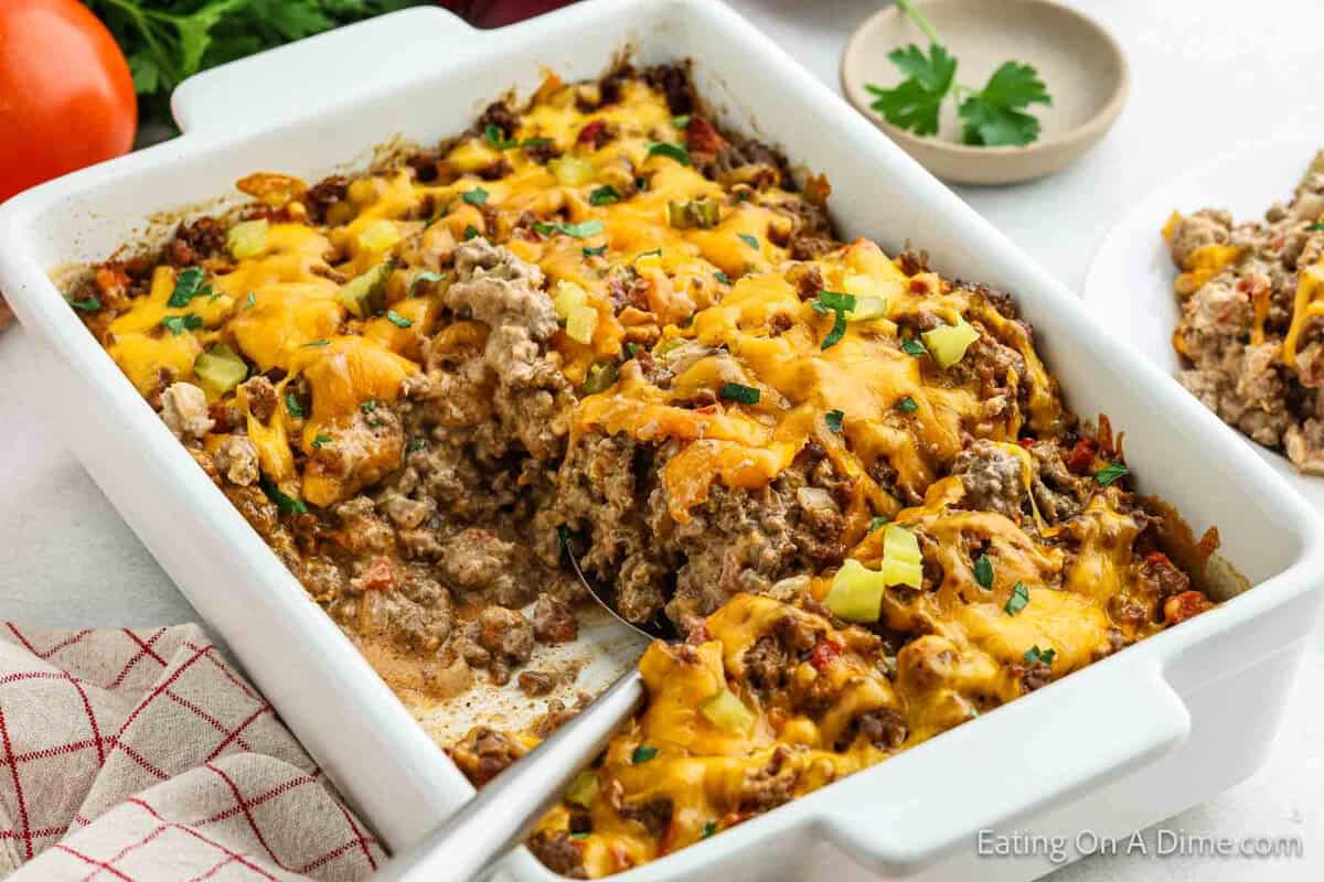 Beef Cheeseburger casserole in a white baking dish