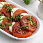 Close up of Slice tomatoes and mozzarella cheese salad on a platter