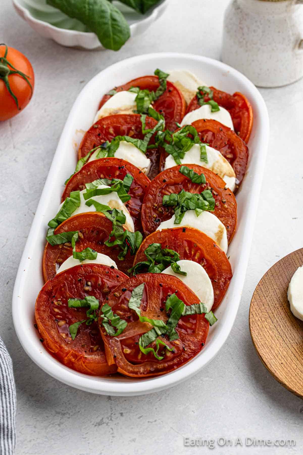 Slice tomatoes and mozzarella cheese salad on a platter