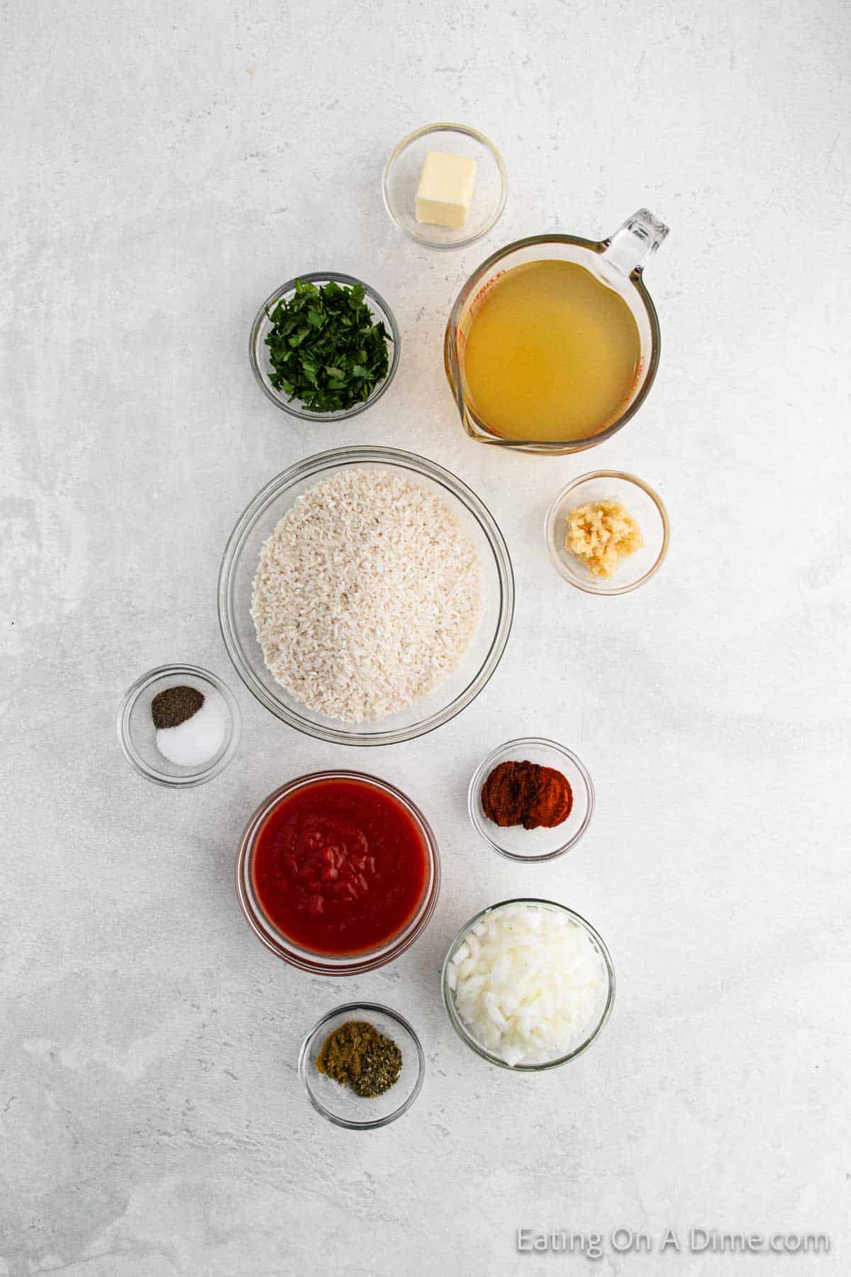 Ingredients - Long Grain White Rice, butter, onion, minced garlic, chicken broth, cumin, chili powder, paprika, dried oregano, salt, pepper, tomato sauce, cilantro