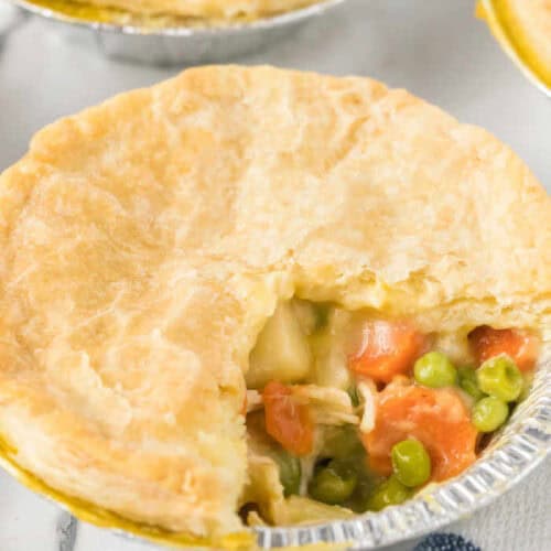 A small chicken pot pie with a bite taken out of it.