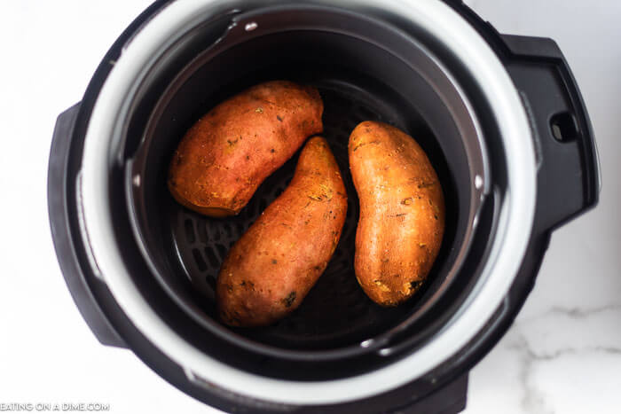 Learn how to make air fryer sweet potato recipe for an easy side dish. These sweet potatoes are tender on the inside and turn out perfectly. Baked sweet potato air fryer is the best way to make the perfect sweet potato. If you are looking for a healthy side dish that is quick, try air fryer baked sweet potatoes for dinner. #eatingonadime #airfryersweetpotatoes #Howlongto #baked #recipes #AirfryersweetpotatoesBaked #bakedsweetpotatoes