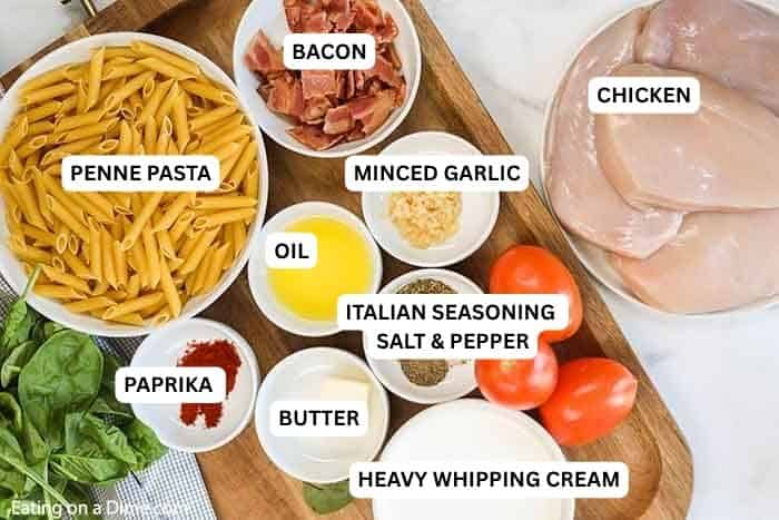Creamy chicken pasta takes only 20 minutes for the best skillet dinner. Skip takeout and make this creamy dish in less time! Ingredients for recipe: penne pasta, bacon, chicken, minced garlic, oil, Italian seasoning, salt, pepper, paprika, butter and heavy whipping cream.