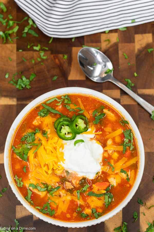 Crock Pot Mexican Chicken Soup is so easy and the flavor is authentic and delicious. Save money and make this restaurant style meal at home. Mexican chicken soup crockpot is homemade and budget friendly. #eatingonadime #MexicanChickenSoup #recipes #recipeshomemade #crockpot #RecipesEasy #EasyRecipes #slowcooker
