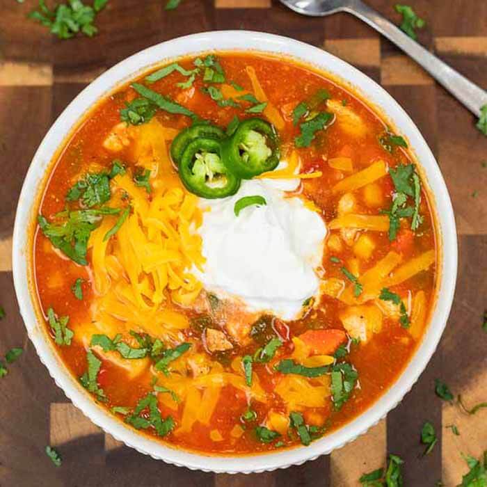 Crock Pot Mexican Chicken Soup is so easy and the flavor is authentic and delicious. Save money and make this restaurant style meal at home. Mexican chicken soup crockpot is homemade and budget friendly. #eatingonadime #MexicanChickenSoup #recipes #recipeshomemade #crockpot #RecipesEasy #EasyRecipes #slowcooker