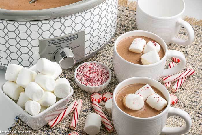 Crock pot hot chocolate recipe is rich and creamy with just 5 simple ingredients. Serve this decadent drink for parties, Christmas and more! Crock pot hot chocolate recipe is the best drink for a crowd and so easy in the slow cooker. Serve homemade hot cocoa for the holidays. #eatingonadime #crockpothotchocolate #RecipeSlowCooker #Foracrowdeasyrecipes #easyfast #withpackets #cocoapowder