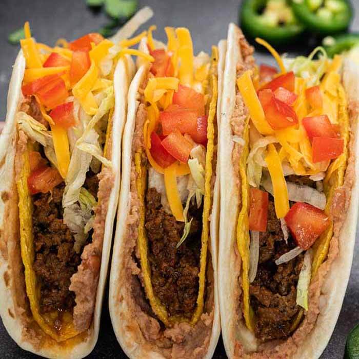 This Double Decker Taco Recipe is perfect for Taco Tuesday and these copycat tacos can be made in under 30 minutes! Learn how to make homemade double decker tacos that are cheesy and packed with ground beef. #eatingonadime #DOUBLEDECKERTACOS #tacobell #recipes #diy #shell #howtomakedoubledeckertacos