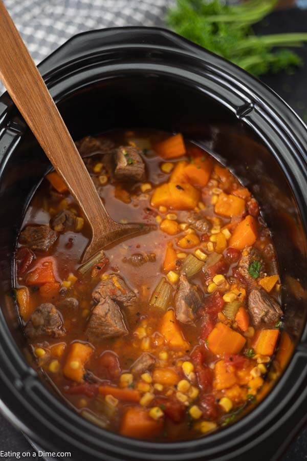 Warm up with this easy Crock Pot Sweet Potato Beef Stew Recipe. Hearty stew meat, sweet potatoes and more blend together for a tasty and simple crock pot meal. Slow cooker sweet potato stew is the best comfort food. If you are looking for an easy and frugal meal, try Crock Pot Sweet Potato Stew. #eatingonadime #crockpotsweetpotatobeefstew #HealthyRecipes #crockpot #sweetpotatostew #SlowCookerBeefand #Crockpotbeefand #SweetPotatoBeefStew