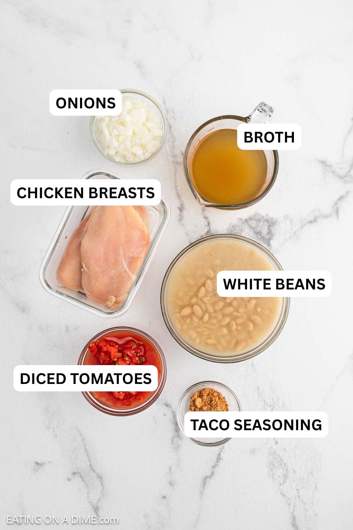 Ingredients needed to make this which includes chicken breasts, diced tomatoes, taco seasoning, onion, white beans, and chicken broth.