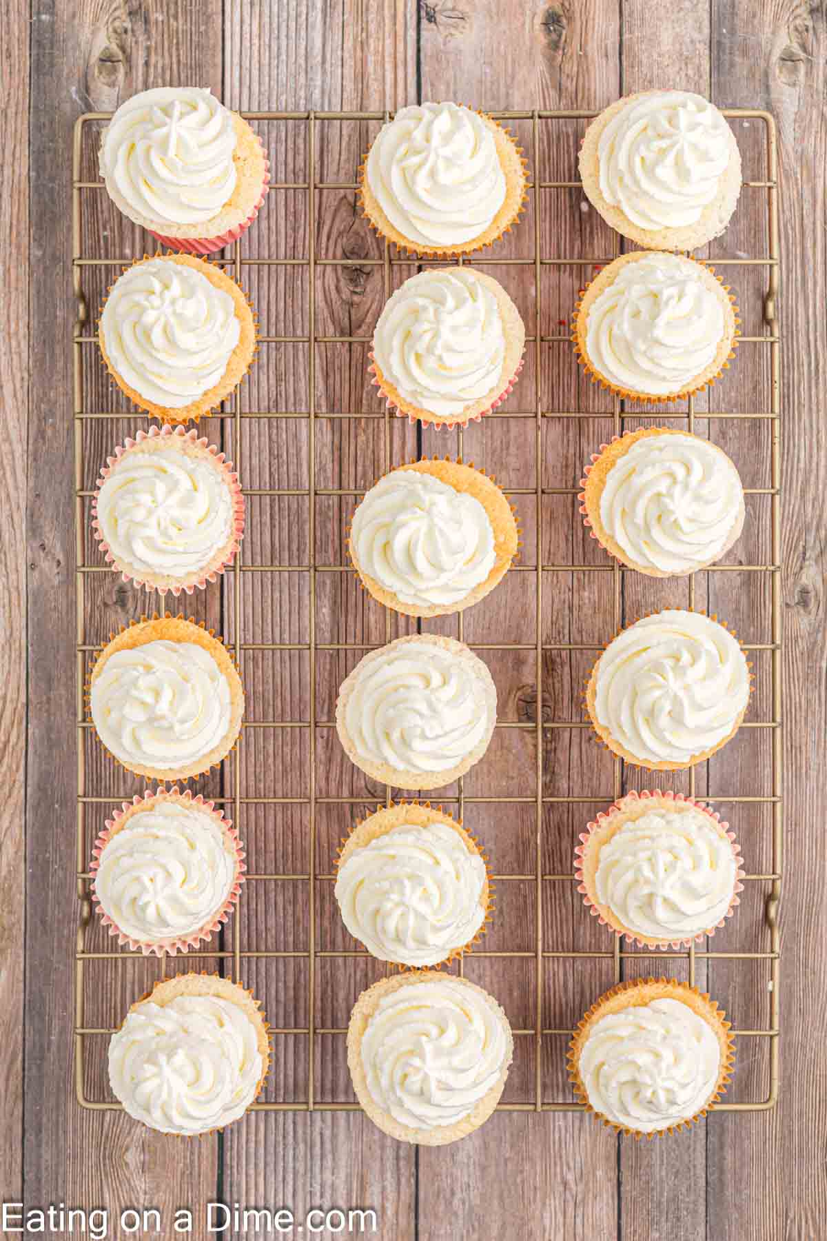 Frosting the cupcakes with the cool whip