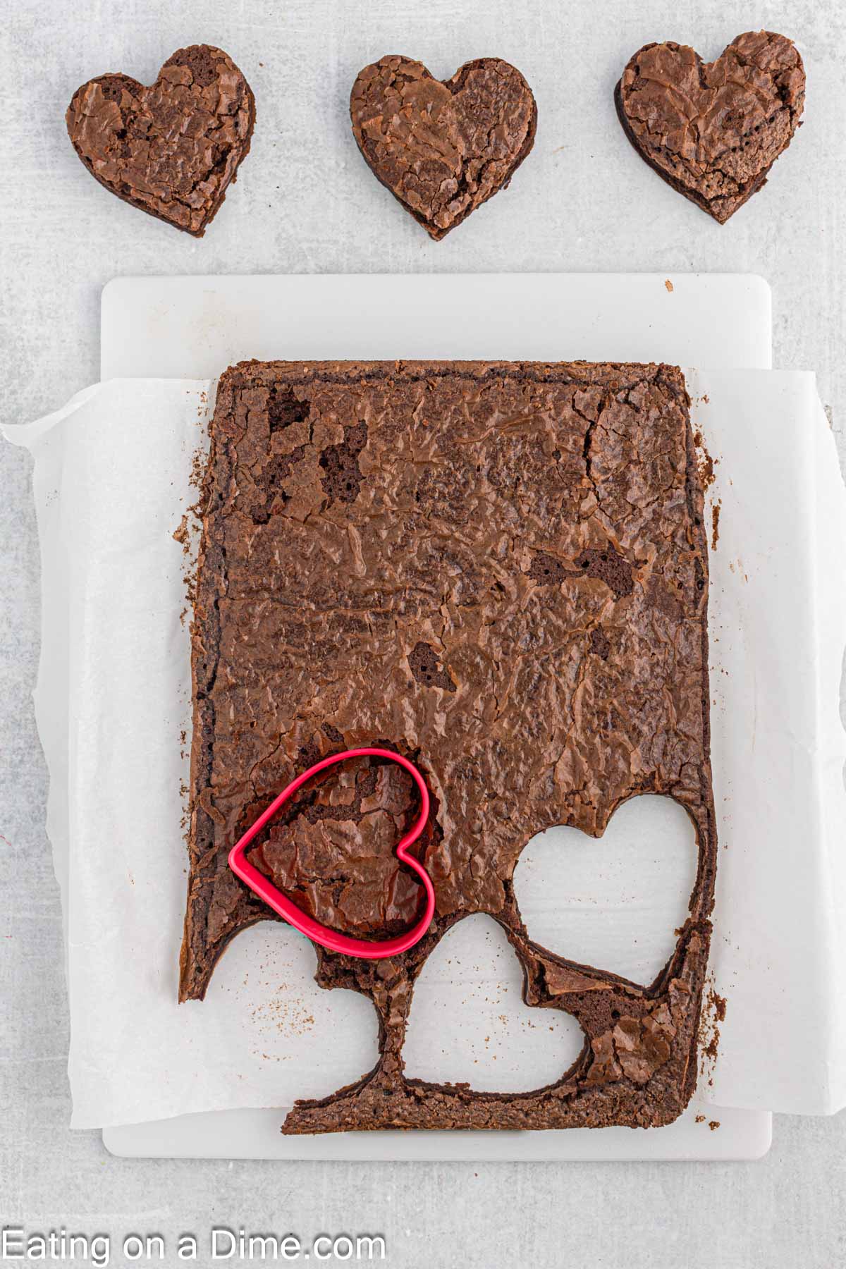 Cutting heart shaped brownies on a cutting board