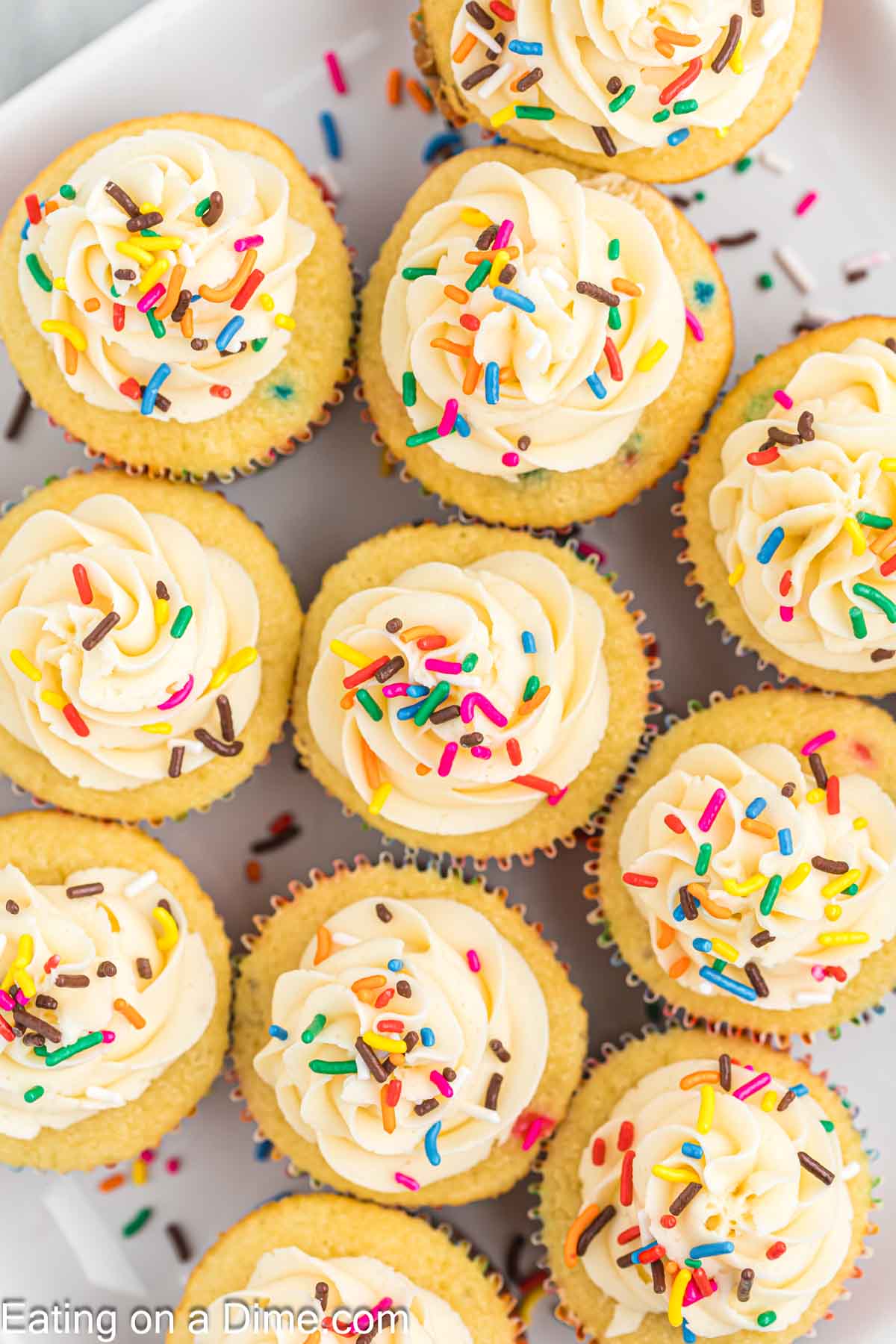 Close up image of funfetti cupcakes close together on a plate