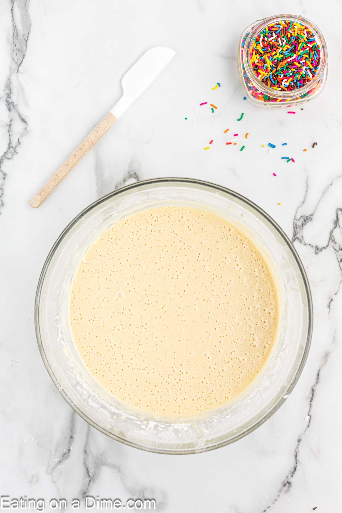 Combining the dry and wet ingredients for the cupcake batter in a bowl