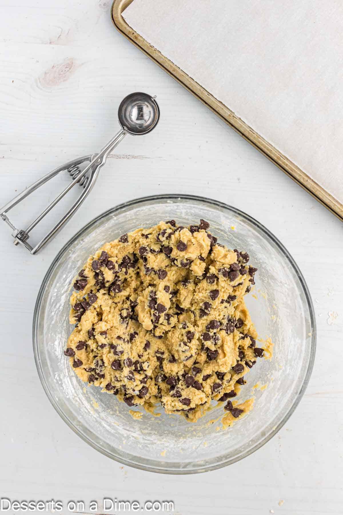 Combining cookie dough in a bowl 