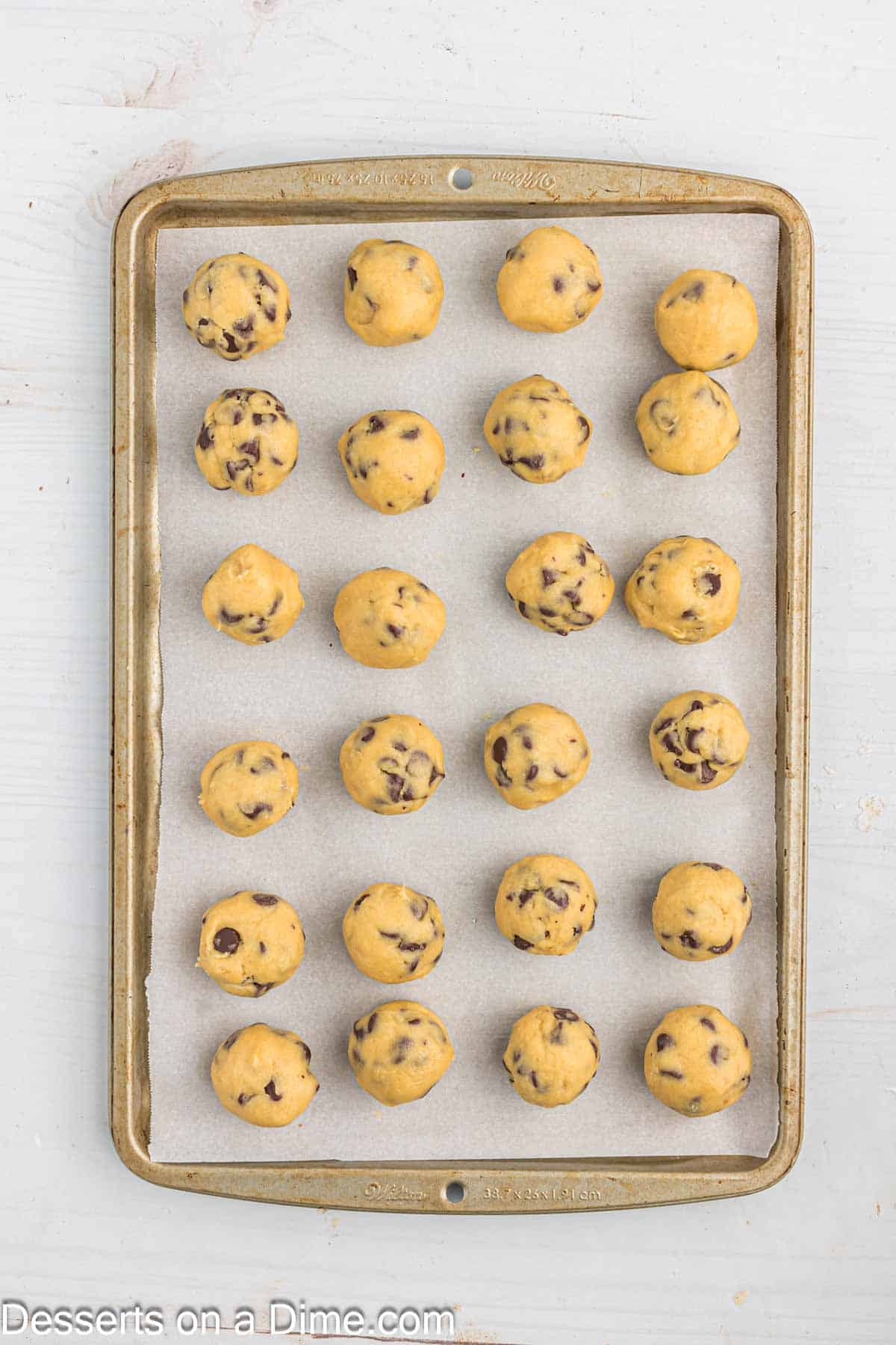 Cookie dough balls on a cookie sheet