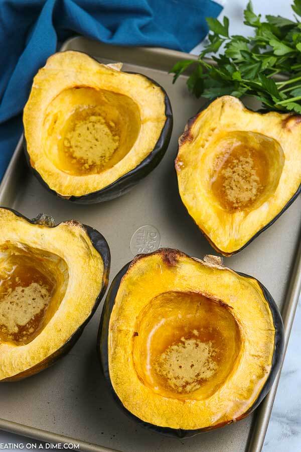 Roasted acorn squash recipe is super easy and really healthy. You only need 5 ingredients for this flavor packed side dish. Learn how to roast acorn squash in oven with brown sugar and maple syrup. Find out how to roast acorn squash for a savory or sweet side dish option. #eatingonadime #roastedacornsquash #recipes #recipeshealthy #Recipesbrownsugar #roastedacornsquashoven #Howlongto #oven #howto