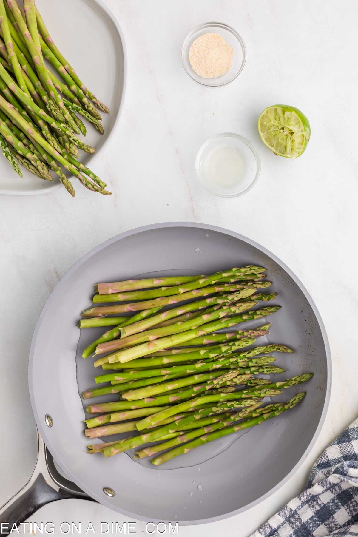 Placing the prepared asparagus in a skillet