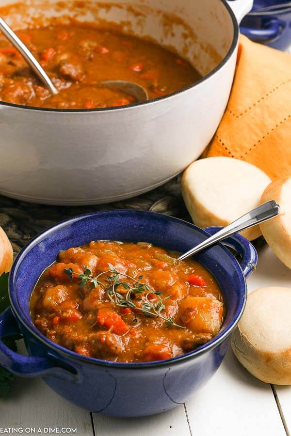  If you love stew, try something different and make this Irish beef stew with guiness. The tomato broth is tangy and the beef is so tender. Irish beef stew recipe is easy to make and the best ever dinner idea. #eatingonadime #irishbeefstew #irishbeefstewstovetop