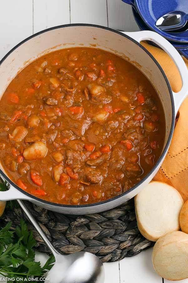  If you love stew, try something different and make this Irish beef stew with guiness. The tomato broth is tangy and the beef is so tender. Irish beef stew recipe is easy to make and the best ever dinner idea. #eatingonadime #irishbeefstew #irishbeefstewstovetop