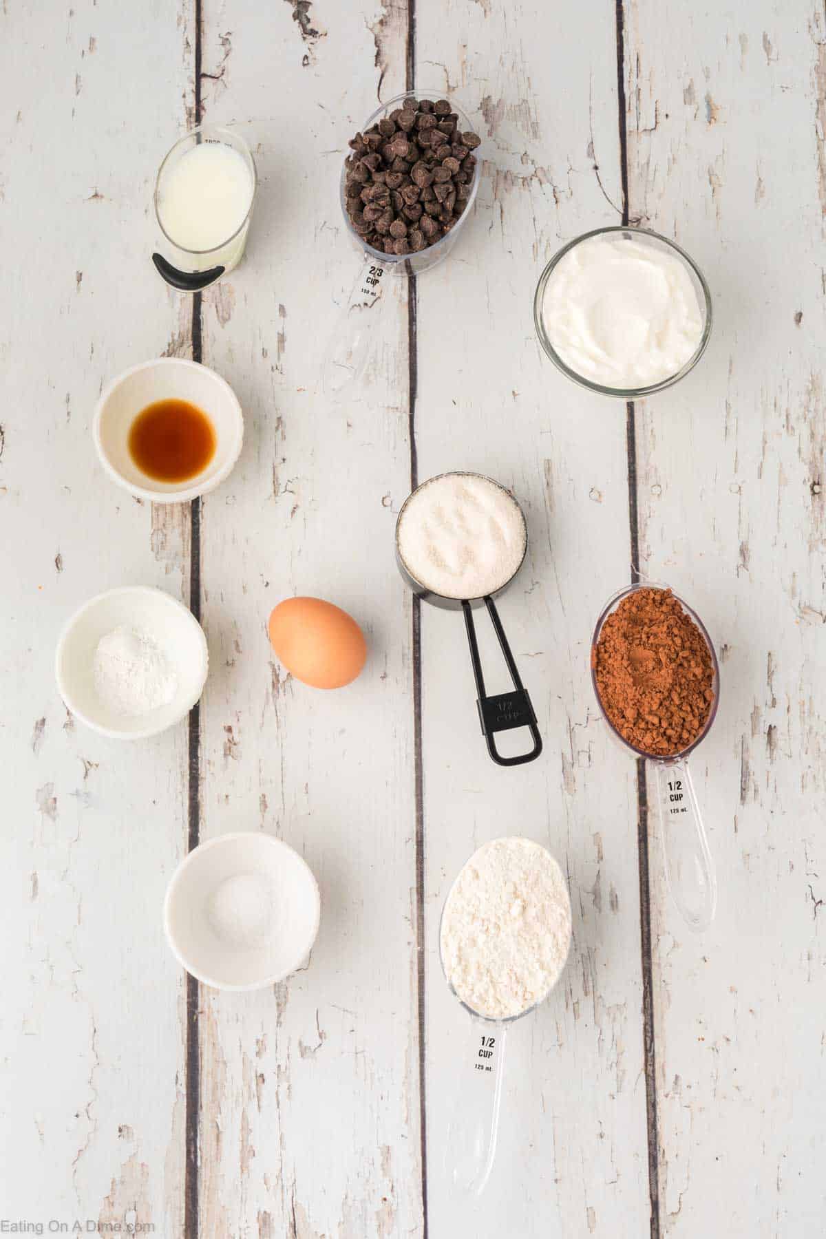 Low calorie brownies ingredients - flour, cocoa powder, baking powder, salt, erythritol, greek yogurt, egg, fat free milk, vanilla extract, chocolate chips