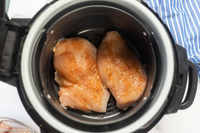 Air fryer chicken breast recipes make an easy and delicious weeknight dinner idea. Each bite is moist and juicy while being simple to prepare. Learn how to make Air fryer chicken that is perfect and healthy. #eatingonadime #airfryerchicken #AirFryerRecipes #boneless