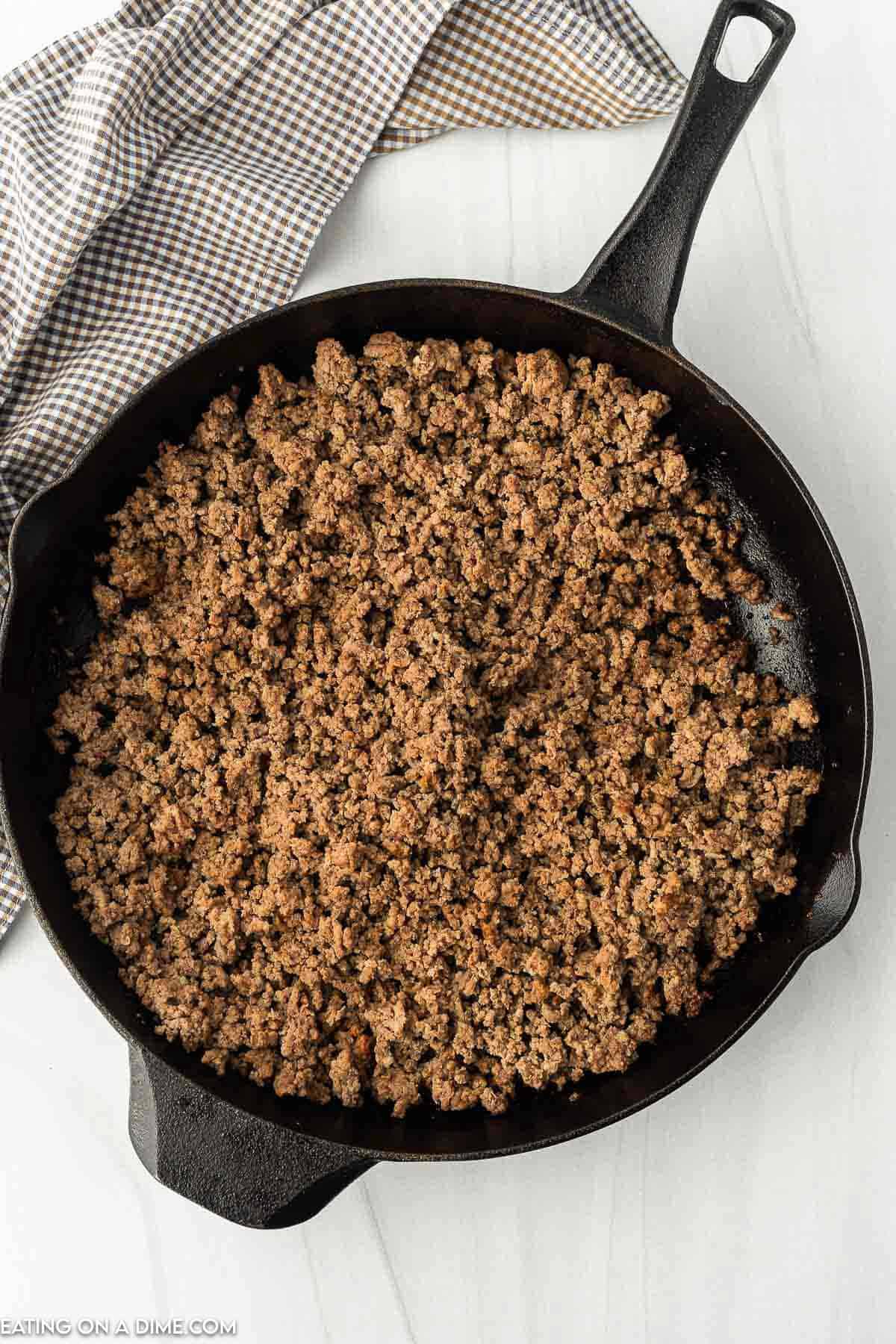 Cooked ground beef in a large cast iron skillet