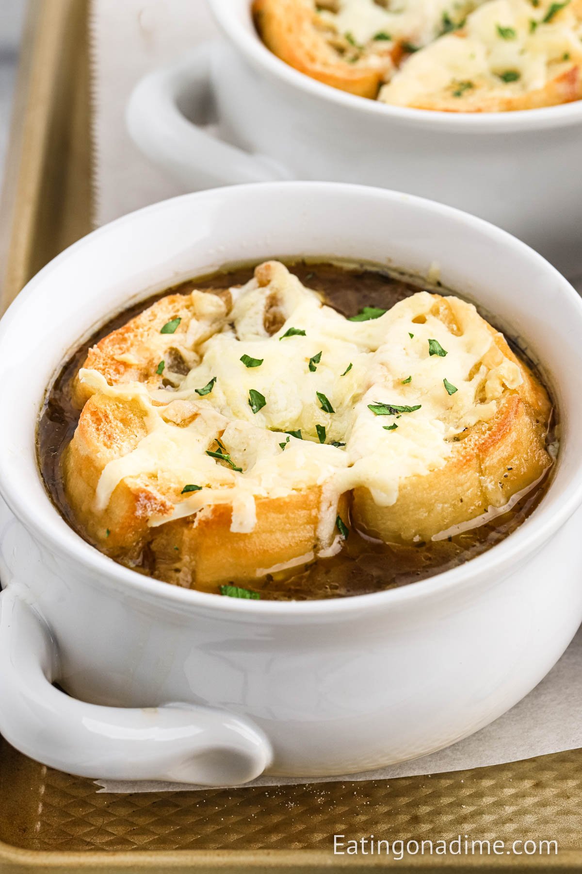 Close up image French Onion Soup in a bowl