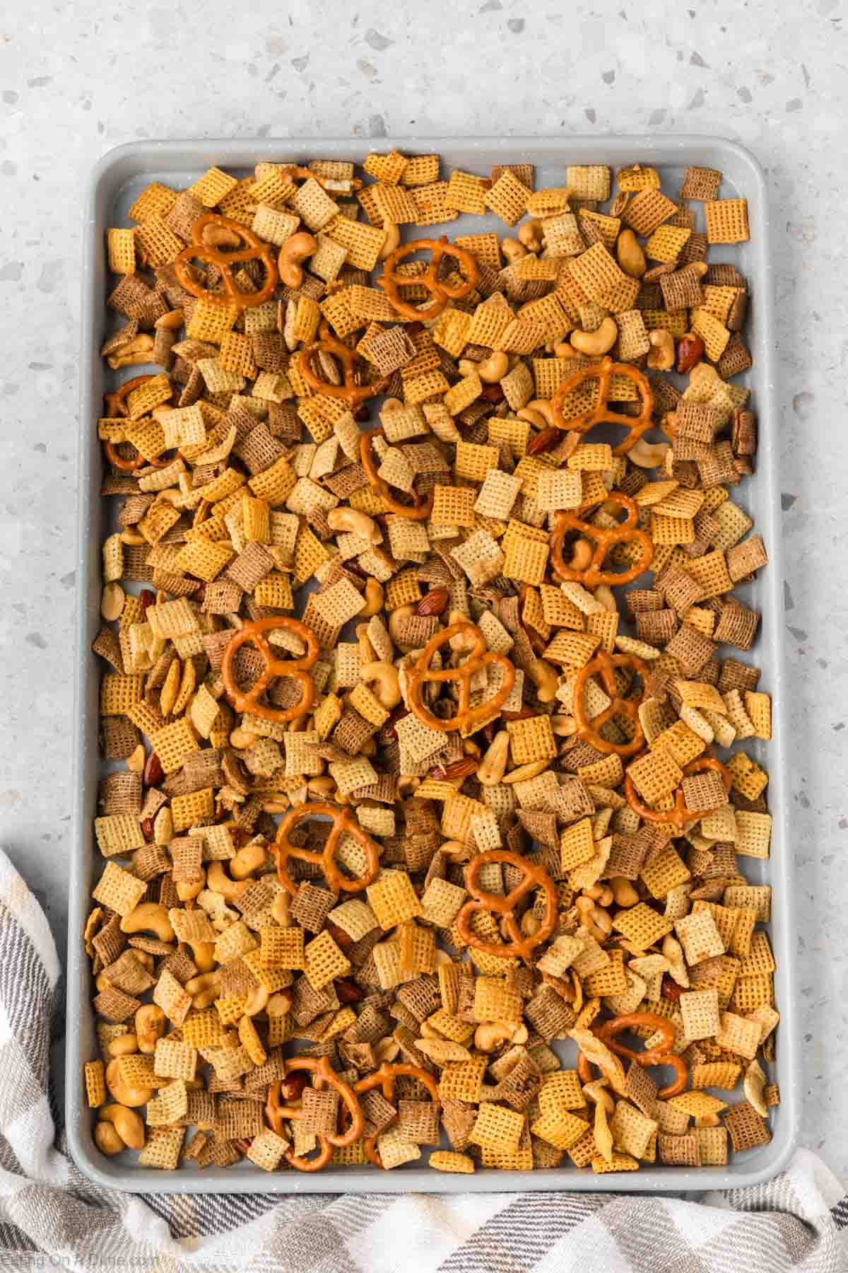 Party Chex Mix on a baking sheet