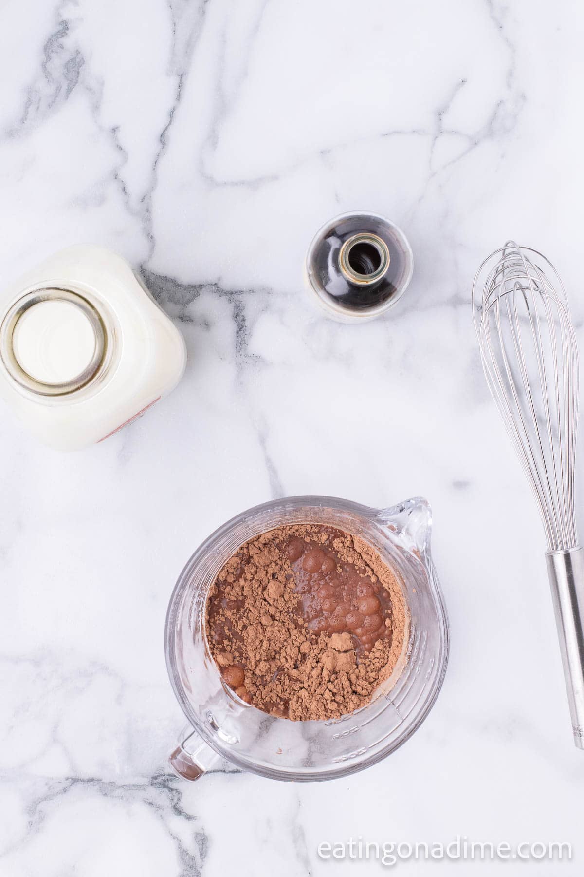 Combining the water, cocoa and sugar in a microwave safe bowl