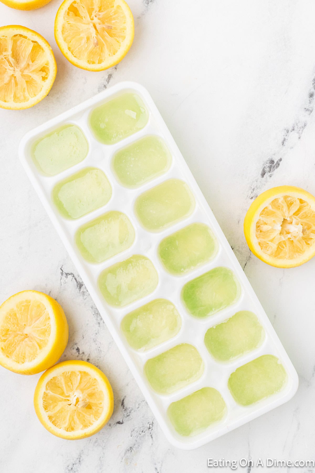 Frozen lemon juice in a ice cube tray 