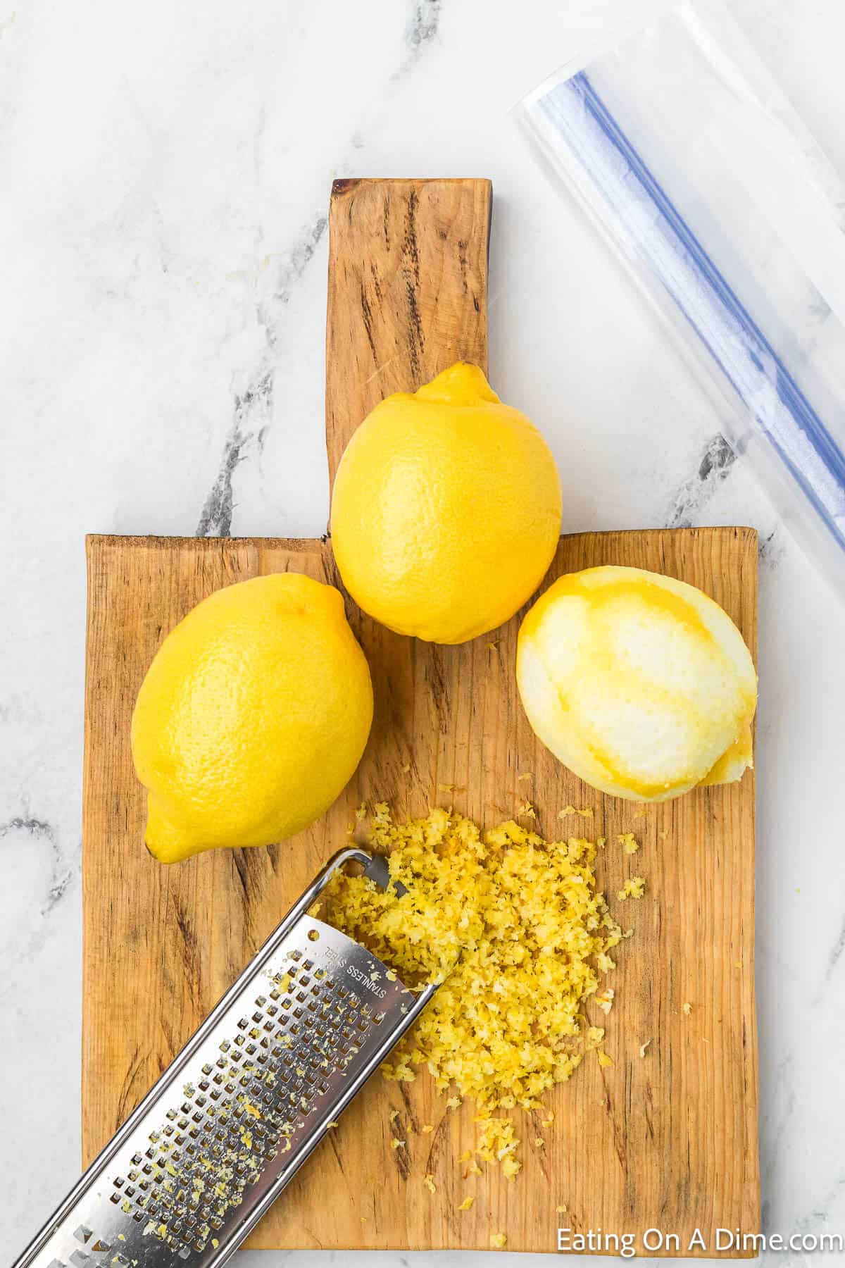 Whole Lemons zested on a cutting board