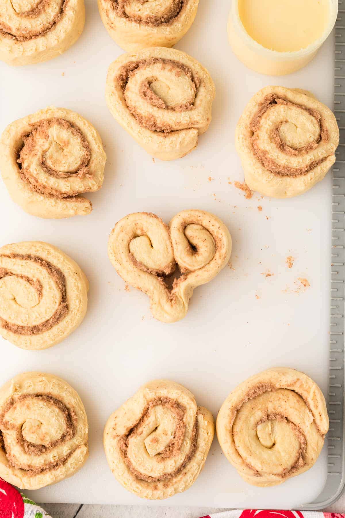 Shaping the cinnamon rolls into a heart