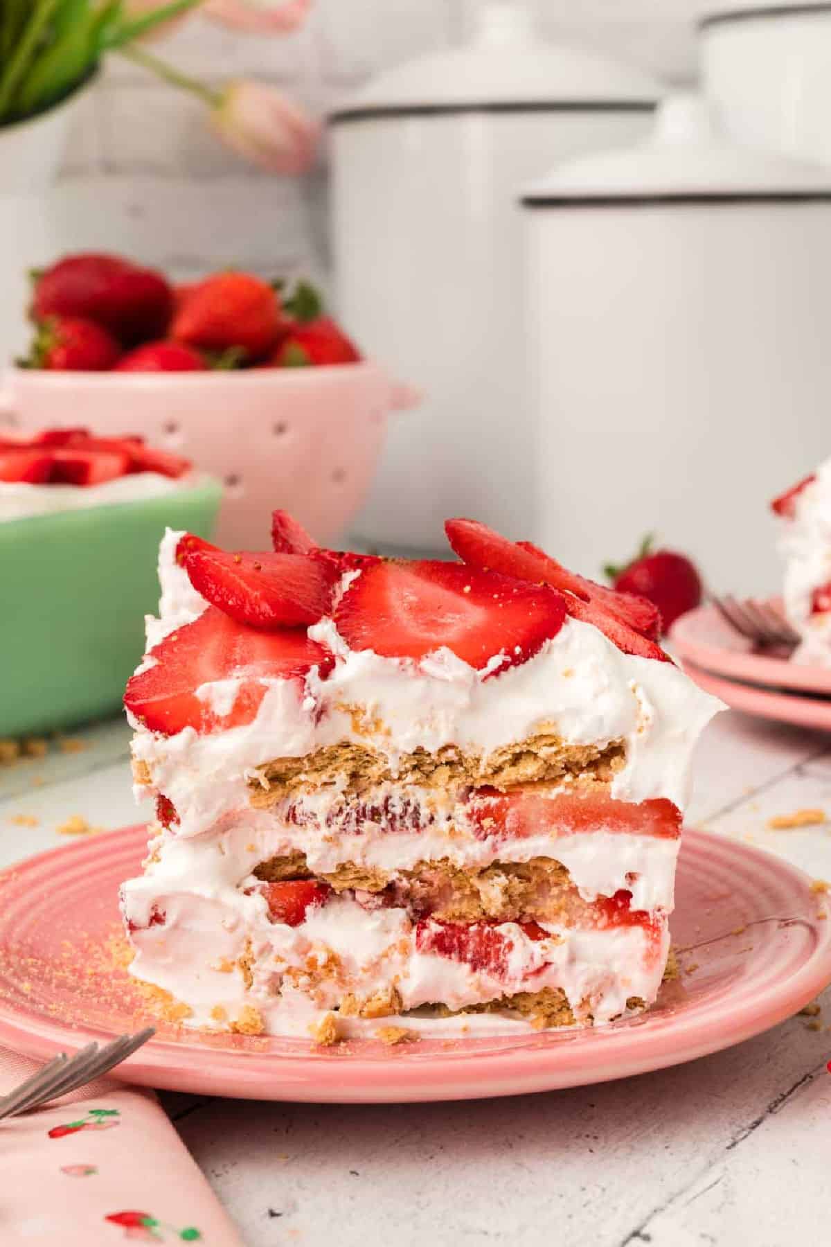 A slice of strawberry icebox cake on a plate 