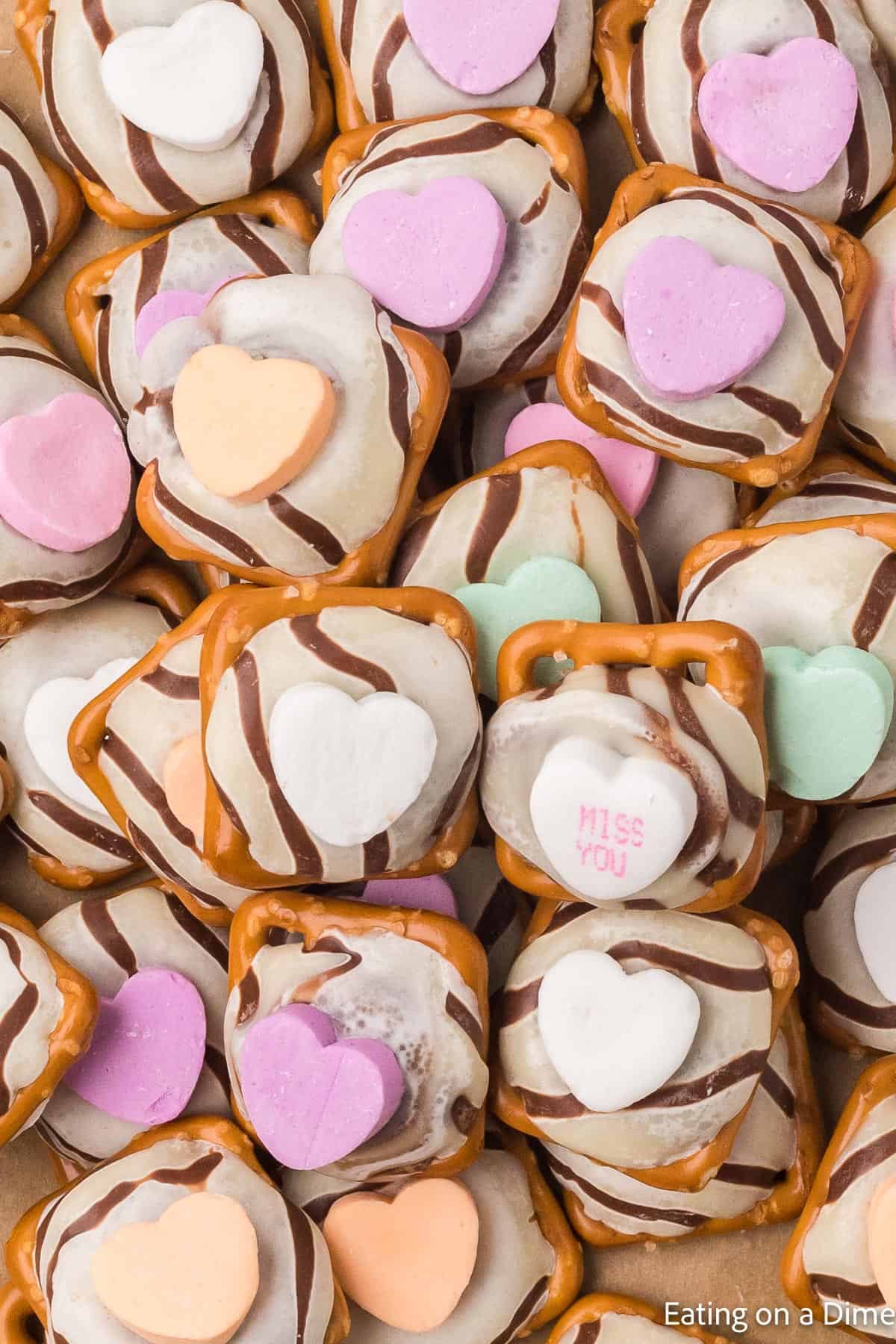 Close up image of Valentine's Day Hershey Kiss Pretzels stacked