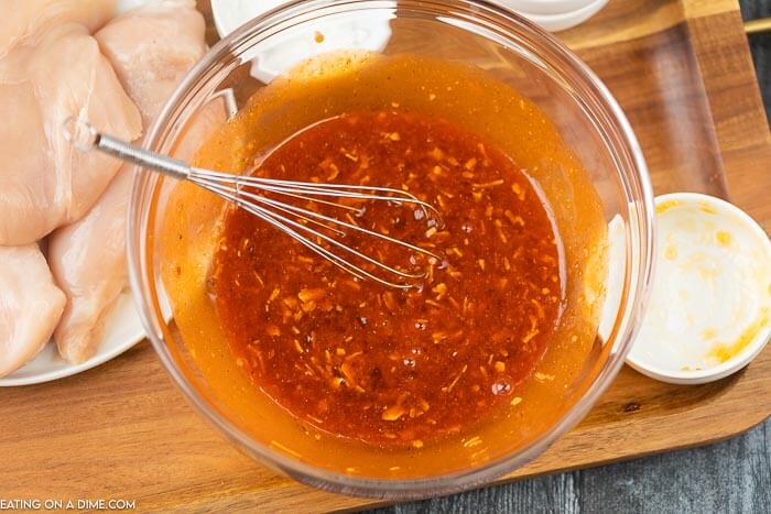 Combining the sauce ingredients in a bowl with a whisk