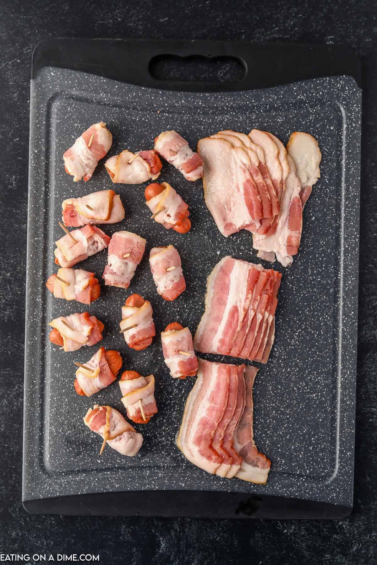 Wrapping little smokies with strips of bacon