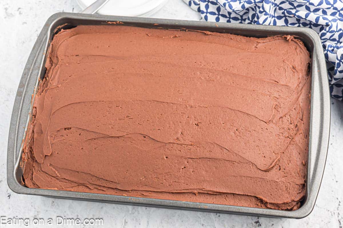 Chocolate Cake topped with chocolate frosting in a baking dish.