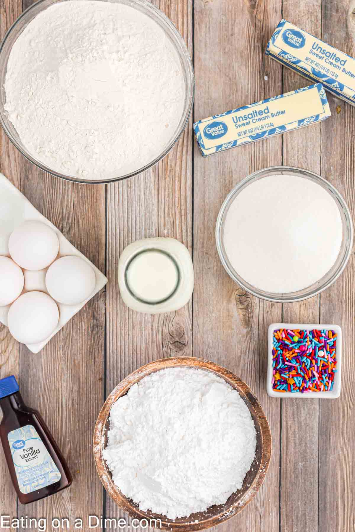 Vanilla Cake Ingredients butter, white sugar, eggs, vanilla extract, flour, milk, powdered sugar, milk, sprinkles