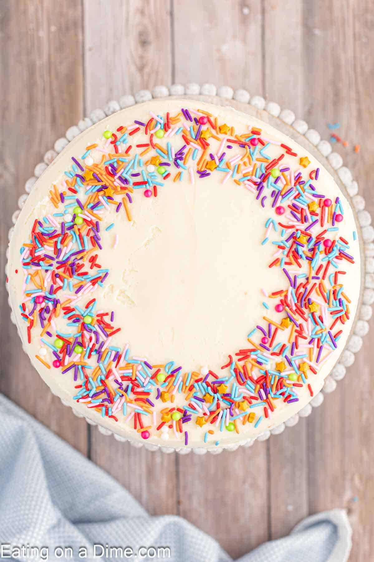Frost cake and top with sprinkles