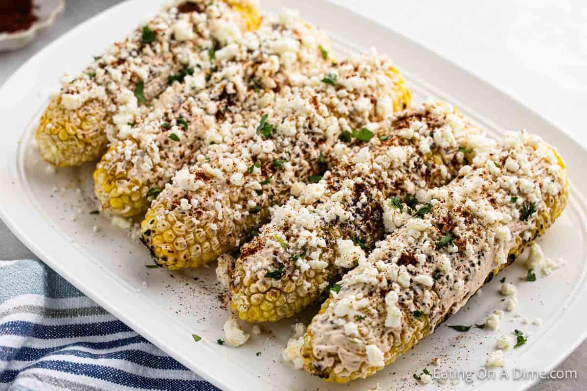 Mexican corn on the cob on a platter 