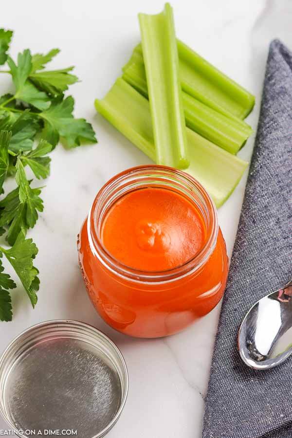Learn how to make Buffalo sauce recipe and never buy store bought again. This is so easy and perfect for chicken wings, drumsticks and more. 